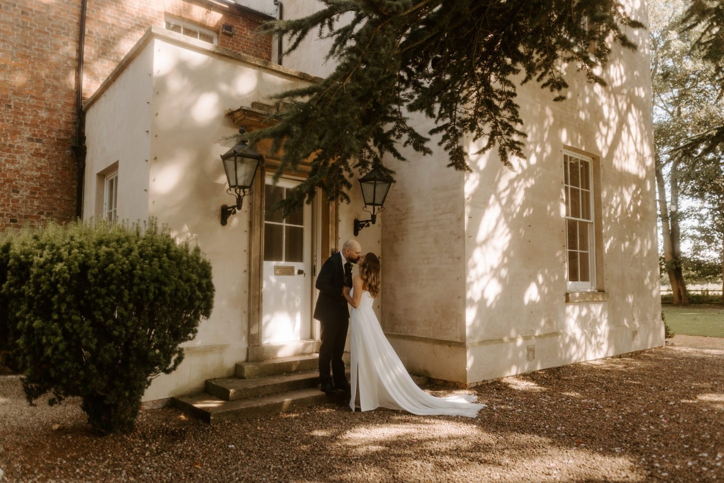 a bride and groom at the doorway of Aswarby Rectory